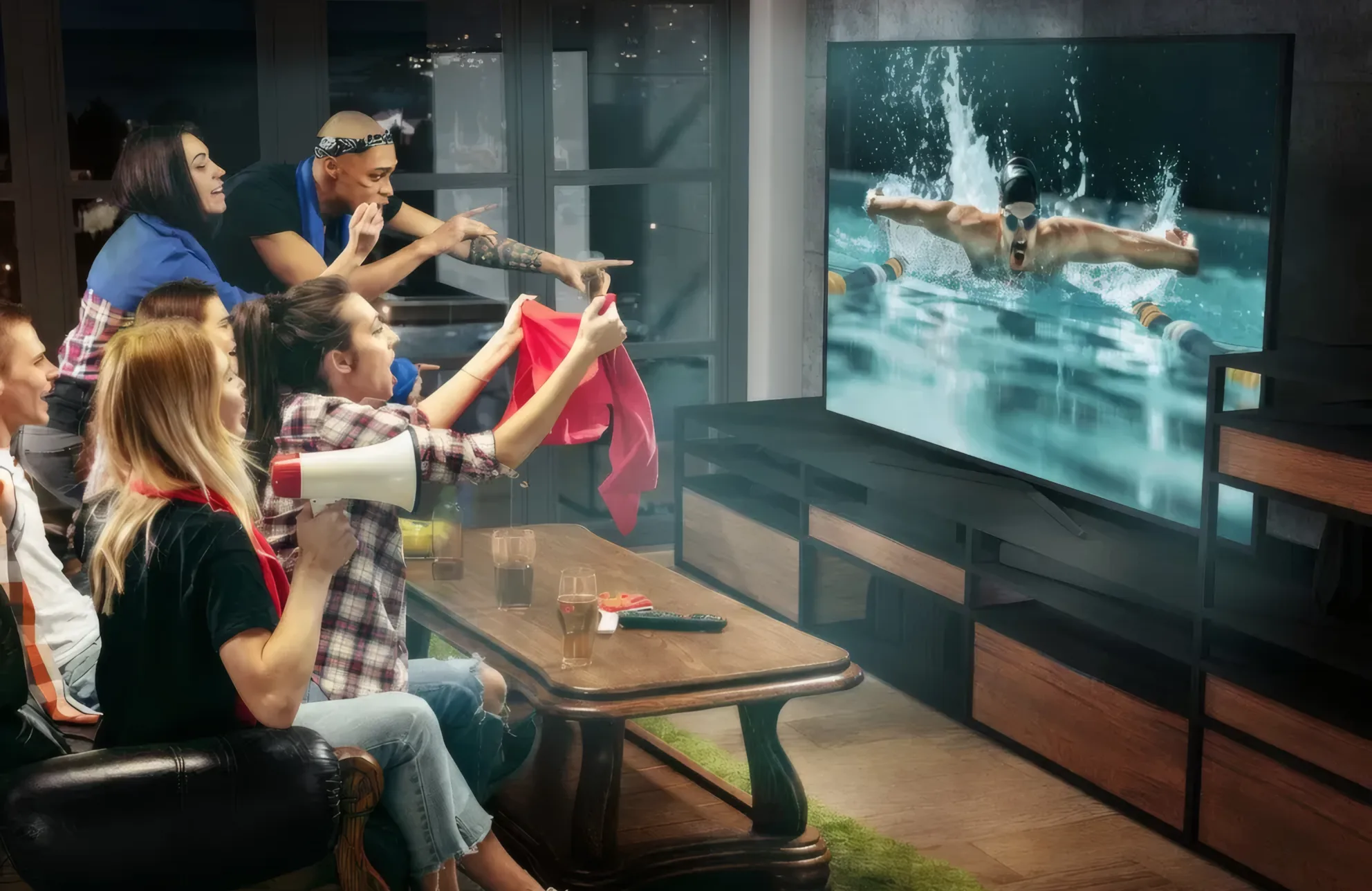 Friends watching live sport on a large TV